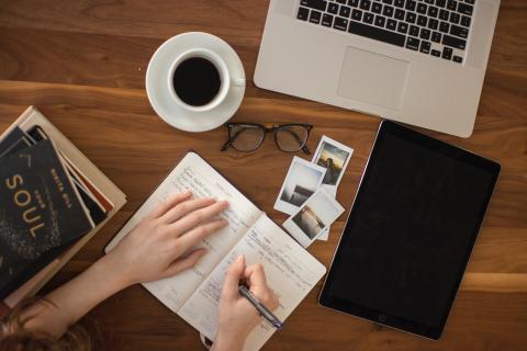 a woman preparing some questions for the interview