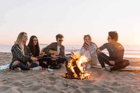 group of young people next to the fireplace