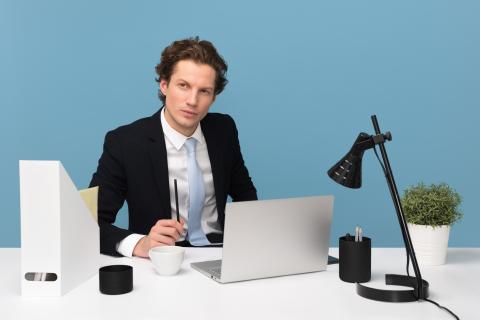 a man sitting at his desk