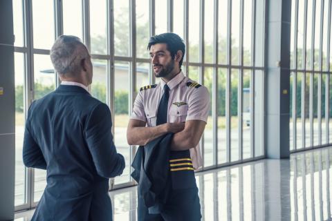 A pilot speaking with a man