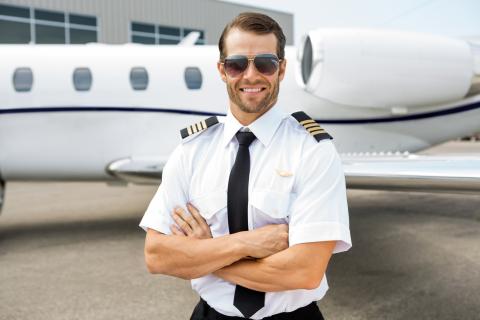 A pilot standing in front of the jet