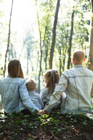 Parents together with their 2 kids